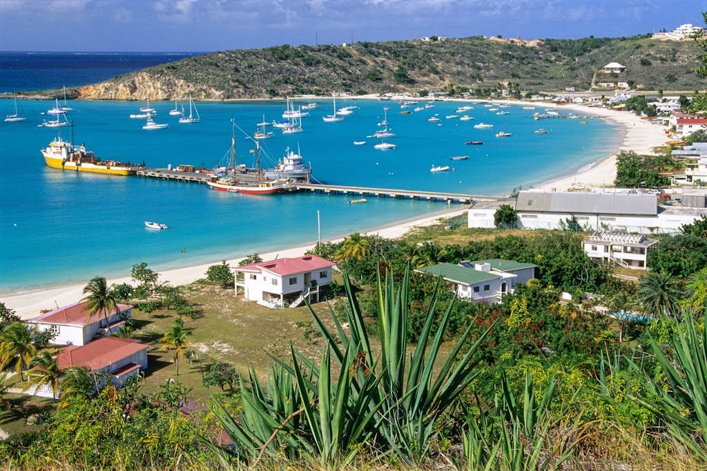 Stunning aerial view of Sandy Ground Bay in Anguilla with boats and turquoise waters.